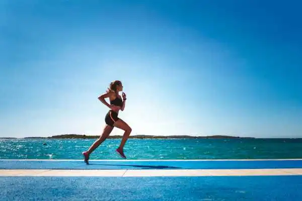 Woman running showing strong leg muscle Hayes